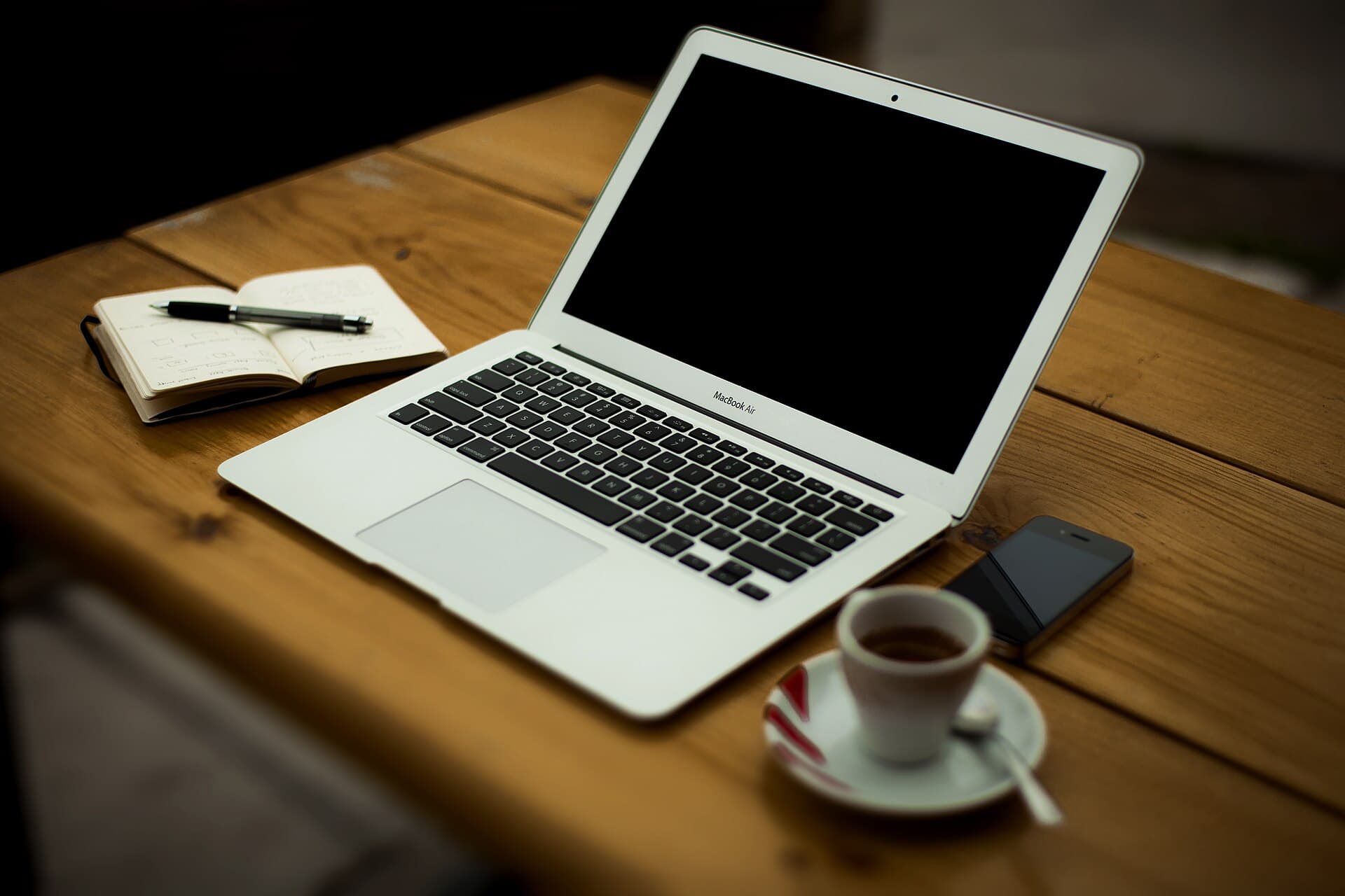 A home office desk with a computer and everyday clutter